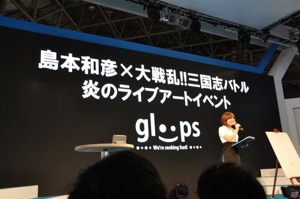 【TGS 2012】島本和彦先生が汗だくで描く力強い「張飛」にどんどん命が吹き込まれるッ！サービスでコンパニオンも直筆イラストに！？の画像1